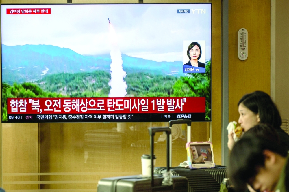 News coverage showing file footage of a North Korean missile launch is seen on a screen at Seoul Station in Seoul. — AFP