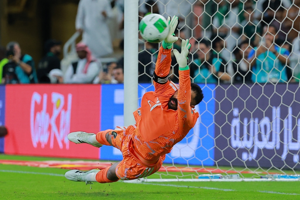 Saudi Arabia goalkeeper Mohammed al Owais saves a shot during the penalty shoot-out in the Gulf Cup semifinal against Qatar at King Abdullah Sports City Stadium, Jeddah, Saudi Arabia. — Reuters