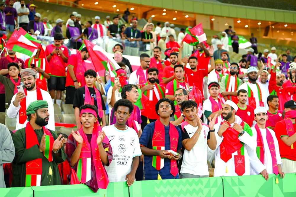 Oman supporters show their backing for the national team from the stands. — Abdulwahid al Hamadani