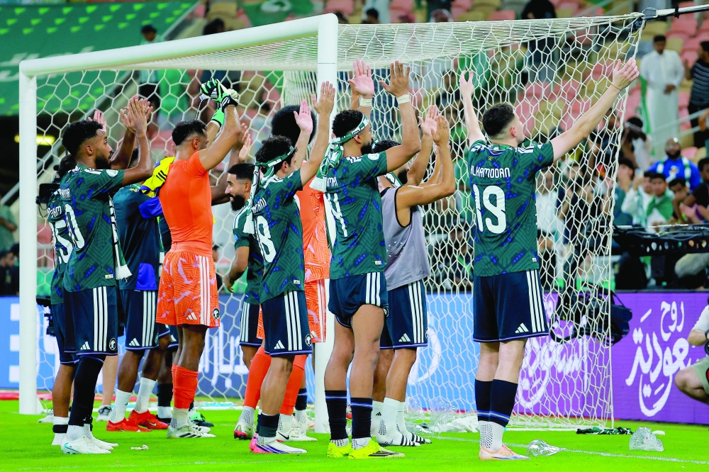 Saudi Arabia's Mohammed al Owais in action during the penalty shootout. — Reuters