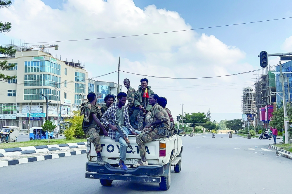 Members of the pro-government Tigray Peace Force patrol the streets of Mekelle, the capital of Ethiopia's Tigray region, in a pickup truck on Sunday. — AFP