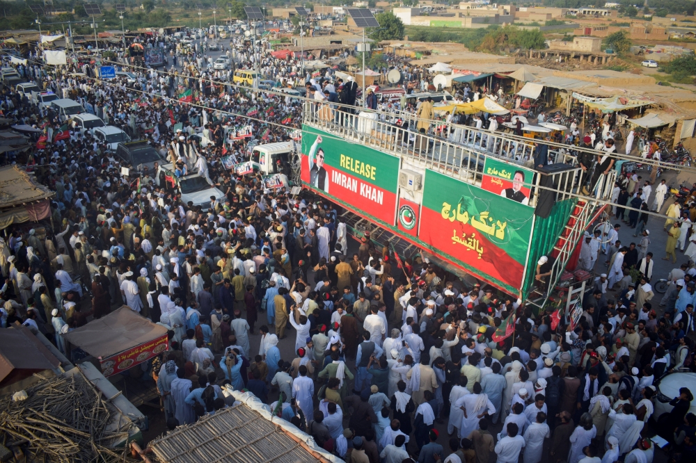 Supporters of former Pakistani Prime Minister Imran Khan's party, Pakistan Tehreek-e-Insaf (PTI), gather during a protest march demanding his release and calling for the supremacy of the Constitution and the rule of law across the country, in Lakki Marwat, Khyber Pakhtunkhwa province, Pakistan, October 4, 2026. 