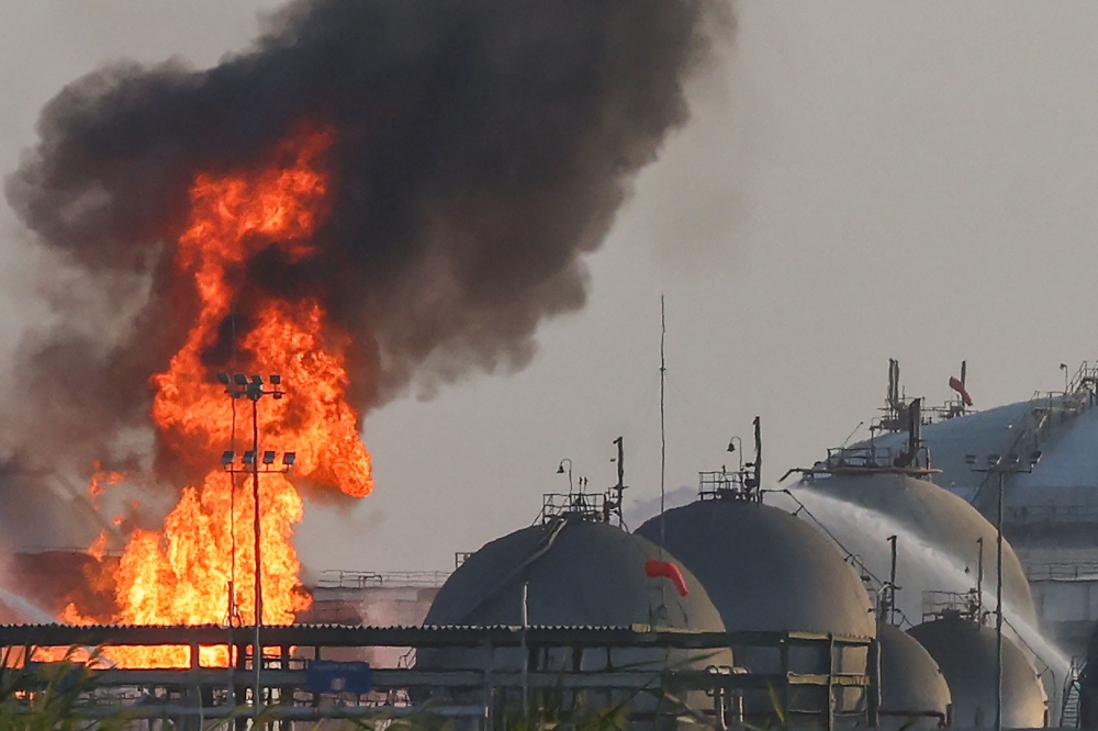 Flames burn at a facility belonging to Saudi oil giant Aramco south of Riyadh on October 3, 2026. 