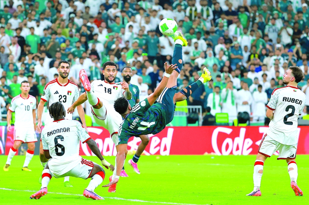 Saudi Arabia's Abdulelah al Amri in action with United Arab Emirates' Luanzinho during the Gulf Cup final at King Abdullah Sports City Stadium, Jeddah. — Reuters