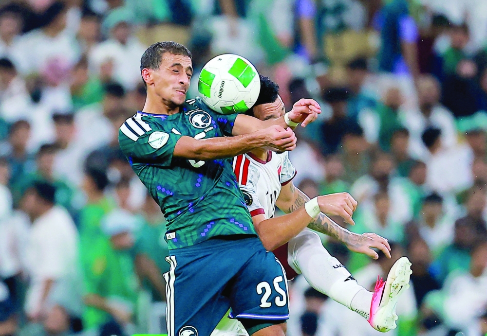 Saudi Arabia's Hammam al Hammami in action with United Arab Emirates' Bruno. — Reuters