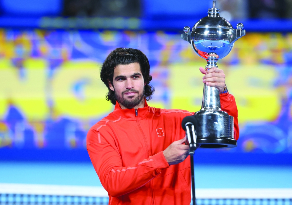 Spain's Carlos Alcaraz celebrates with the Japan Open trophy after winning the final against Czech Republic's Jiri Lehecka. — Reuters