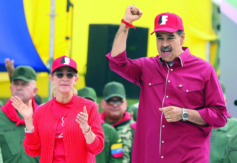 Ousted Venezuelan President Nicolas Maduro and his wife Cilia Flores at a rally in Caracas in February 2025. — AFP file photo