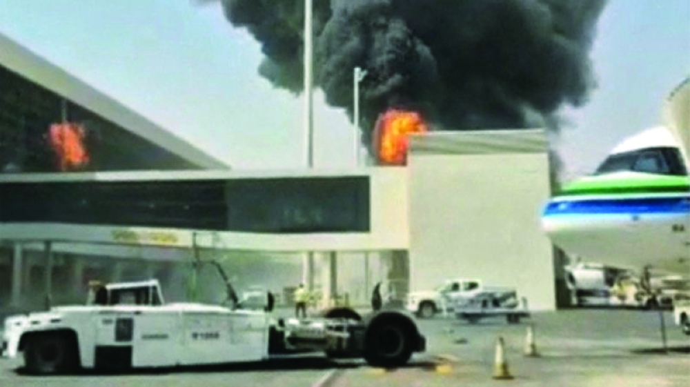 A screengrab shows smoke and flames rise from King Khalid International Airport in Riyadh on Thursday. — Reuters