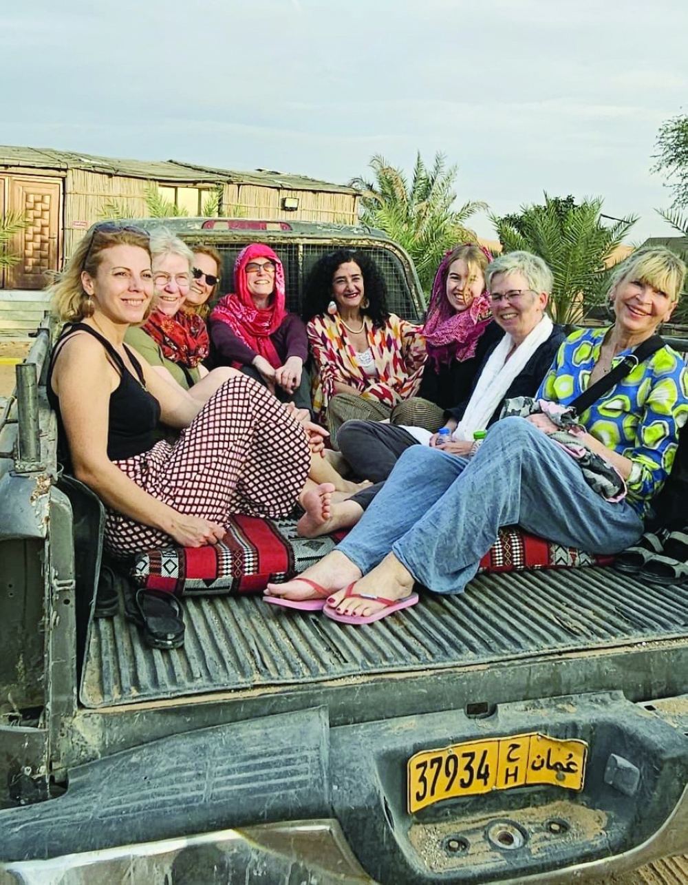 Women tourists enjoy a desert camp ride at Rimal Al Sharqiya