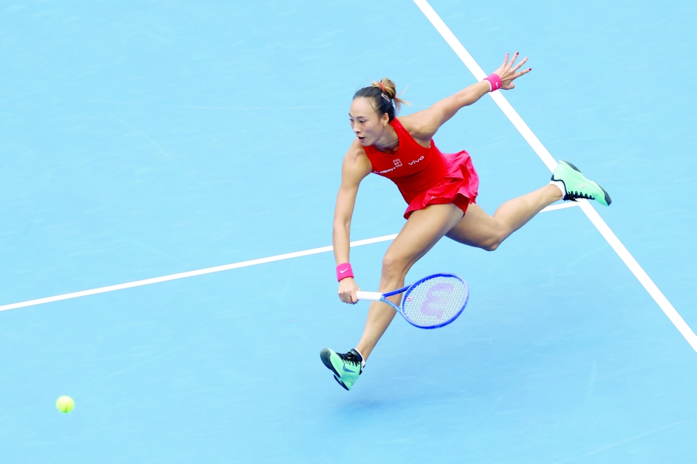 China's Qinwen Zheng in action during her quarterfinal against Ukraine's Elina Svitolina at China Open. — Reuters