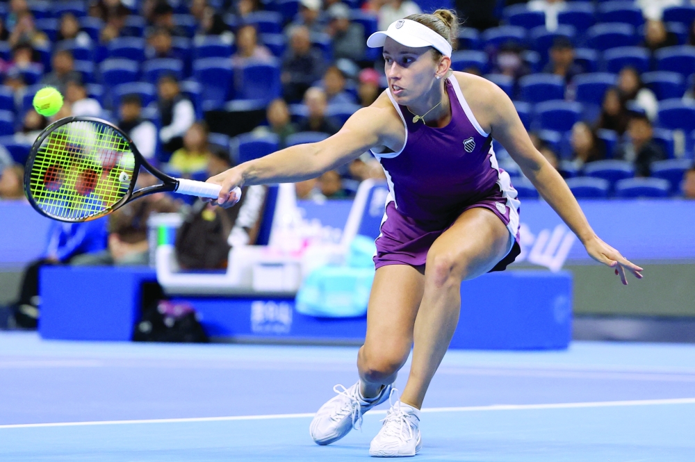 Belgium's Elise Mertens in action during her quarterfinal against Poland's Iga Swiatek. — Reuters