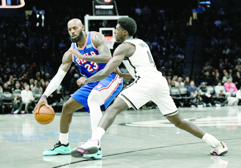 Philadelphia 76ers' Lebron James (23) tries to drive past Brooklyn Nets' Drake Powell (4) at Barclays Center. — Imagn Images