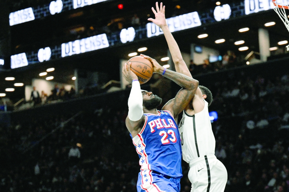 Philadelphia 76ers' Lebron James (23) drives to the basket while defended by Brooklyn Nets' Josh Minott (00) at Barclays Center. — Imagn Images
