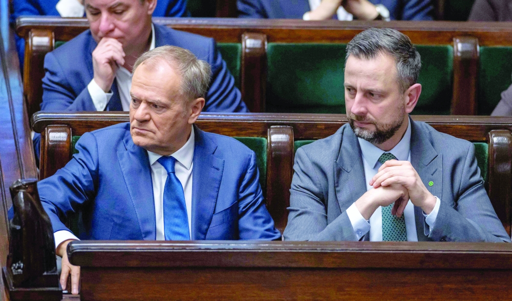 (L-R) Poland's PM Donald Tusk and Poland's Deputy PM and Minister of Defence Wladyslaw Kosiniak-Kamysz attend a session of parliament in Warsaw. — AFP file photo 