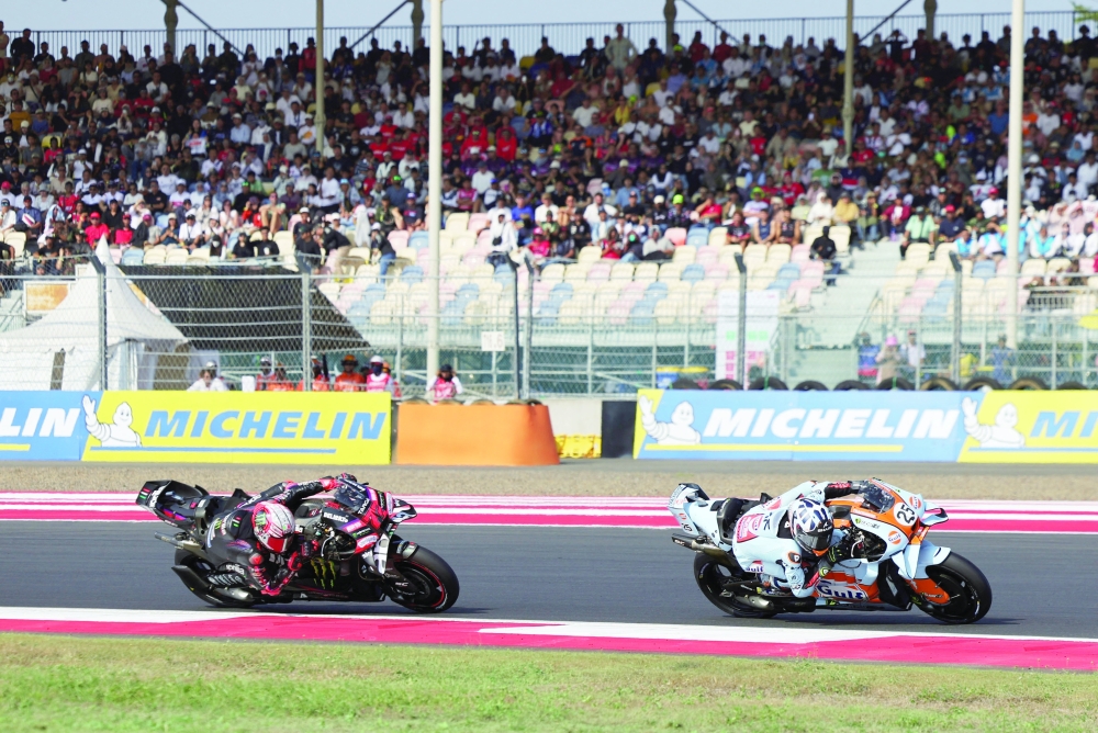 Aprilia Racing's Marco Bezzecchi and Trackhouse MotoGP Team's Raul Fernandez in action during the MotoGP race. — Reuters