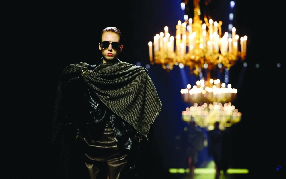 Models walk the runway in creations by Anthony Vaccarello for Saint Laurent