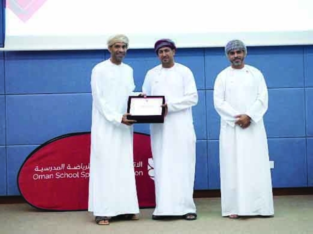 Officials attend the launch ceremony of the new school sports programme.