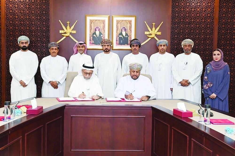 Officials at the signing of the usufruct agreement at OPAZ headquarters in Muscat. — ONA