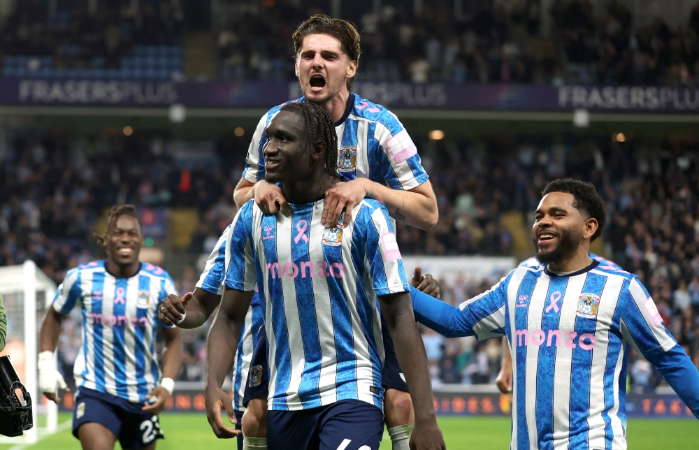  
Coventry City's Sidiki Cherif celebrates scoring their second goal with Jack Rudoni  