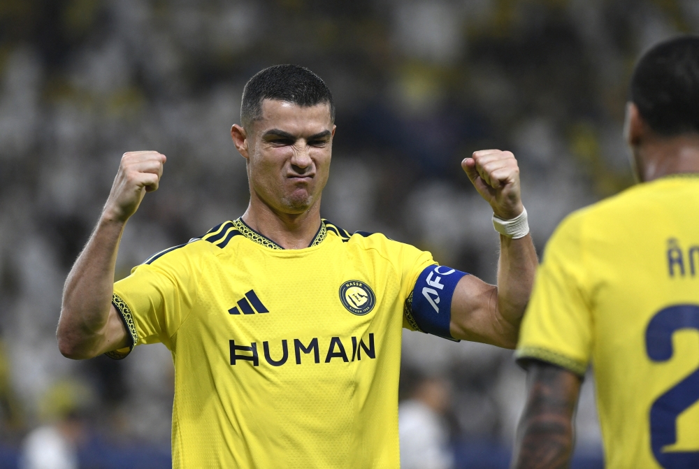  
Al Nassr's Cristiano Ronaldo celebrates their first goal, scored by Angelo