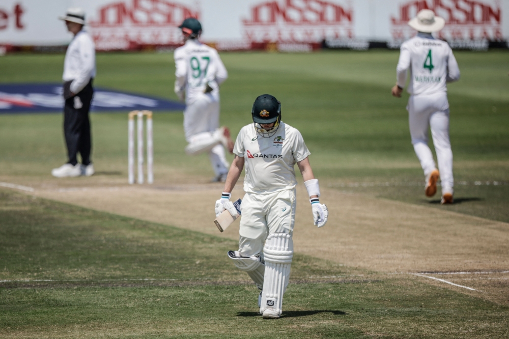 Australia's Steven Smith walks back to the pavilion after his dismissal on day four of the first Test match  