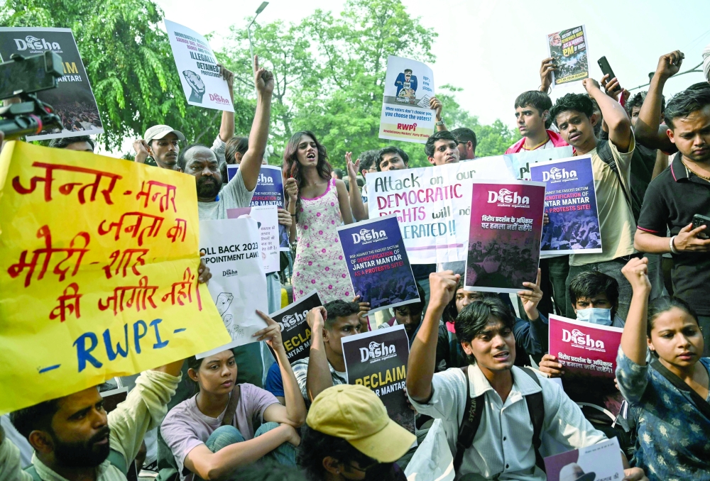 Student activists shout slogans during a protest demanding the resignation of the nation's Chief Election Commissioner in New Delhi. — AFP