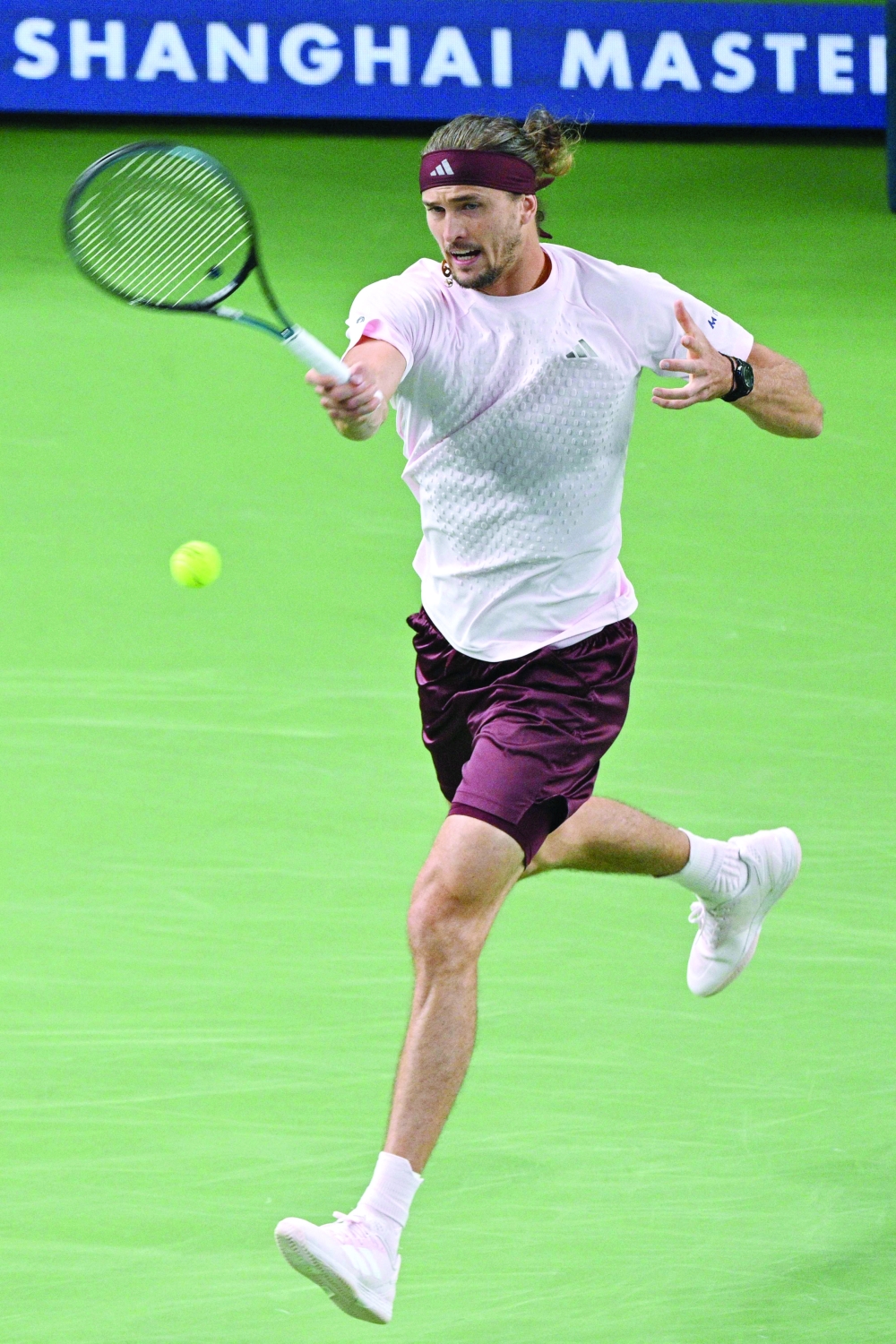 Germany's Alexander Zverev hits a return to Kazakhstan's Alexander Bublik during their men's singles match at the Shanghai Masters tennis tournament in Shanghai on October 13, 2026.  (Photo by Hector RETAMAL / AFP)
