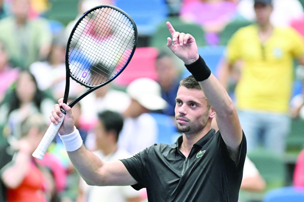 France’s Arthur Gea celebrates after beating Czech Republic’s Jakub Mensik in their men's singles match at the Shanghai Masters tennis tournament in Shanghai on October 13, 2026. China OUT
 (Photo by CN-STR / AFP)
