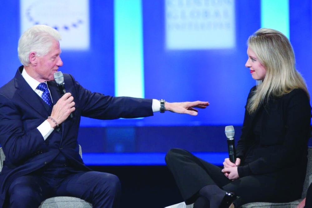 Disgraced Theranos founder Elizabeth Holmes, who spoke to former president Bill Clinton at an event in 2015, is the subject of a new documentary — AFP