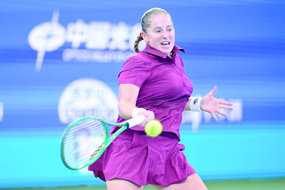 Latvia's Jelena Ostapenko hits a return to USA's Jessica Pegula during their women's singles match at the Wuhan Open tennis tournament in Wuhan, China's Hubei province on October 14, 2026. (Photo by WANG Zhao / AFP)
