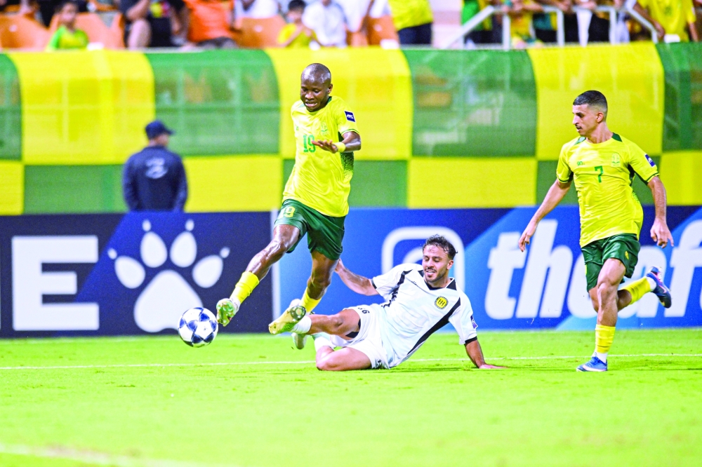 Seeb and Jordan’s Al Hussein players fight for the ball during the AFC Champions League Two Group D match at the Seeb Stadium. — Abdulwahid al Hamadani 