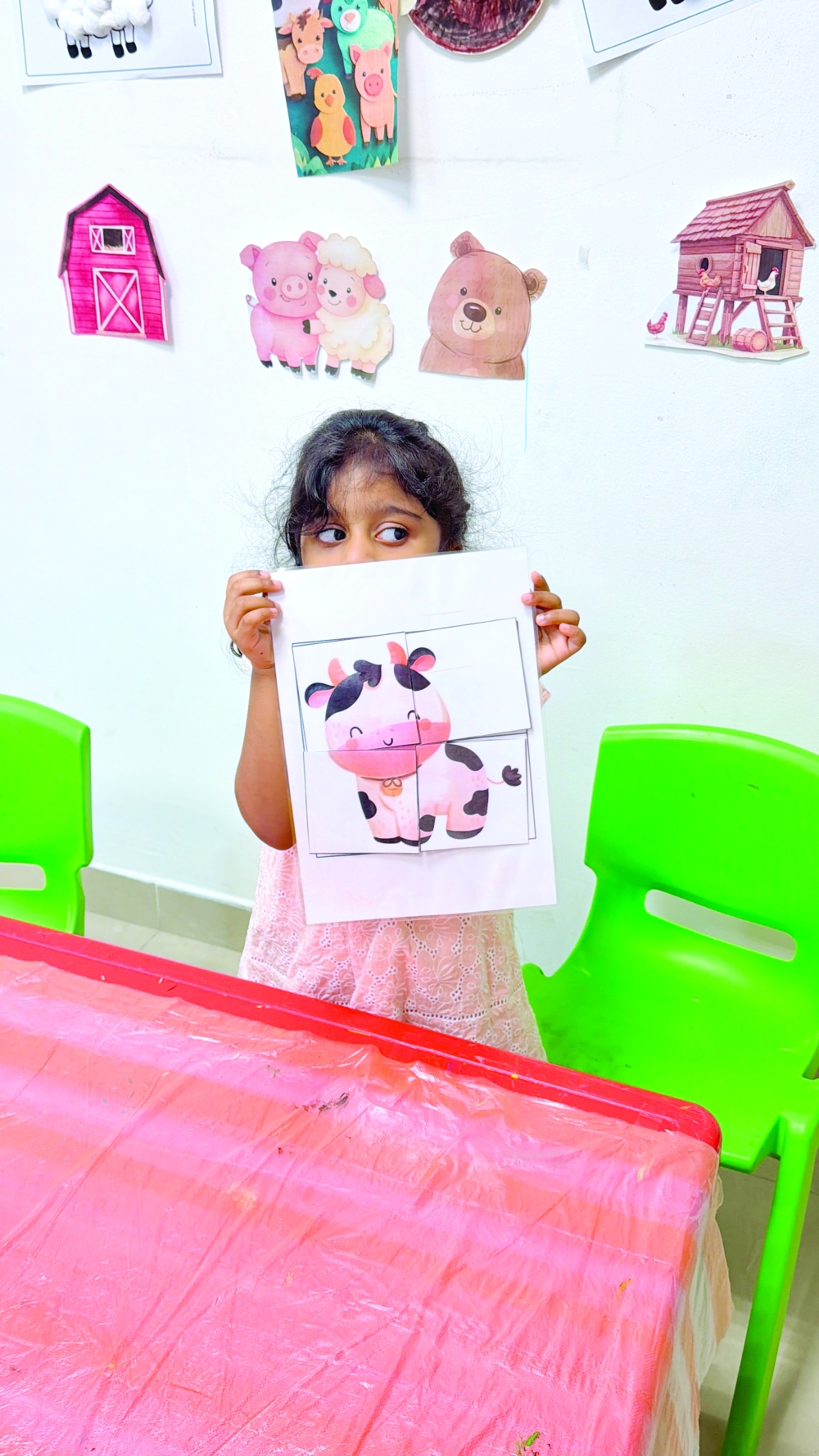 
Emma showcases her cow puzzle at Gentle Adventures. 