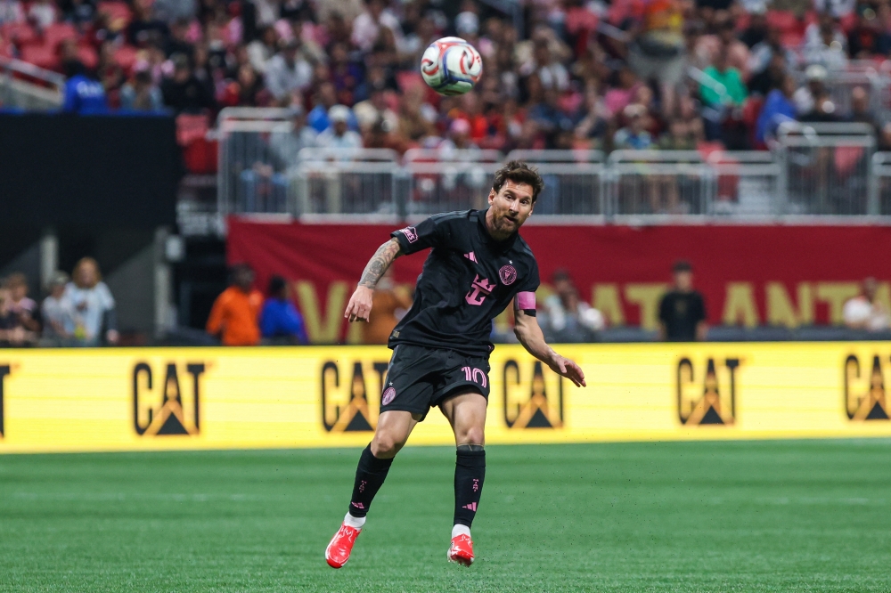   Inter Miami CF forward Leo Messi (10) jumps to head the ball during the game against the Atlanta United  