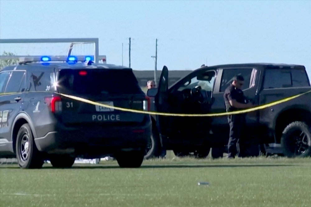 Police attend the scene where a vehicle drove through a soccer game at the Stryker Sports Complex in Wichita 
