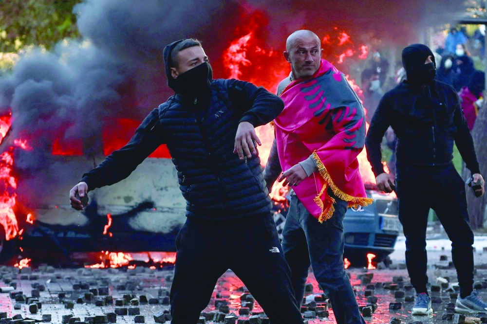 Demonstrators clash with police amid an anti-government protest held by students, in Tirana, Albania. — Reuters 