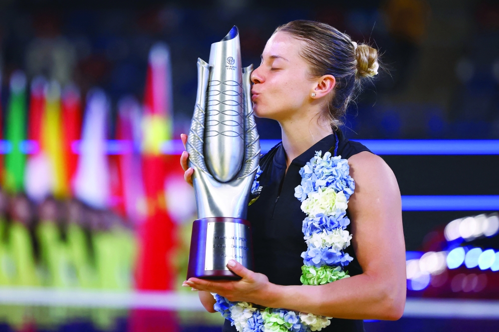 JBUPoland's Maja Chwalinska celebrates with the trophy after winning her singles final match against Britain's Sonay Kartal. — Reuters