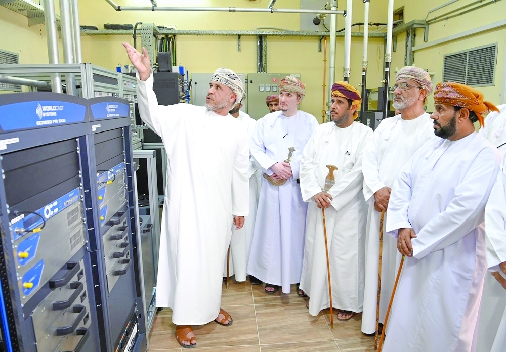 Officials tour the transmission equipment at the new radio station in the Wilayat of Maqshin. — ONA