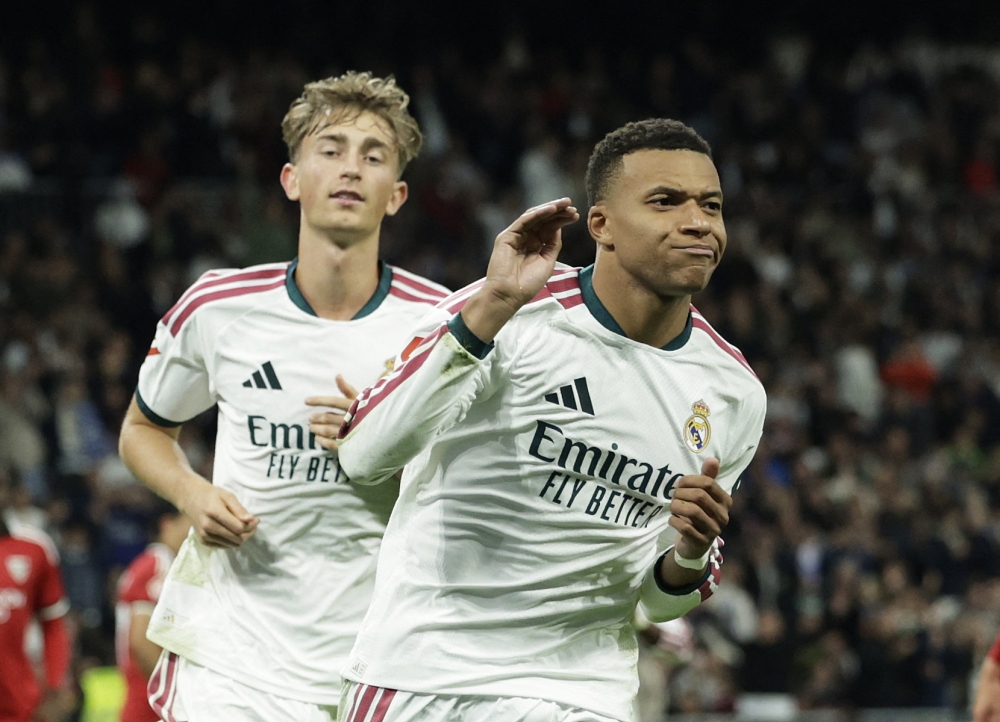  
Real Madrid's Kylian Mbappe celebrates scoring their third goal  