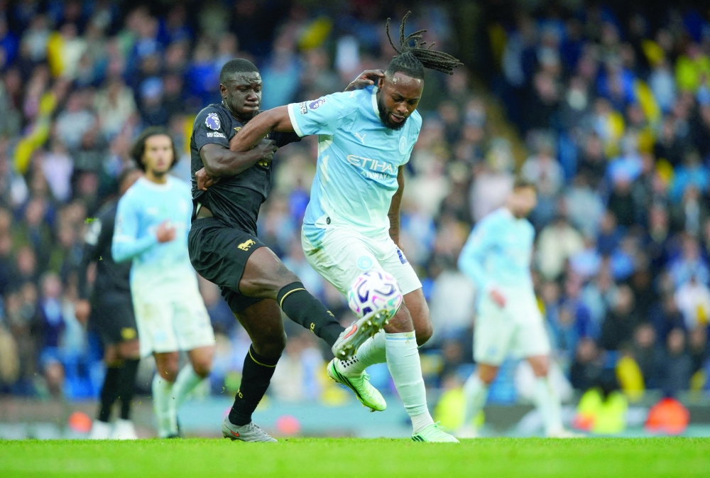 Manchester City's Antoine Semenyo in action with Ipswich Town's Azor Matusiwa. — REUTERS