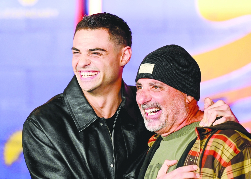 US actor Noah Centineo and his dad movie producer Greg Centineo attend the premiere of Paramount Pictures' "Street Fighter". — AFP