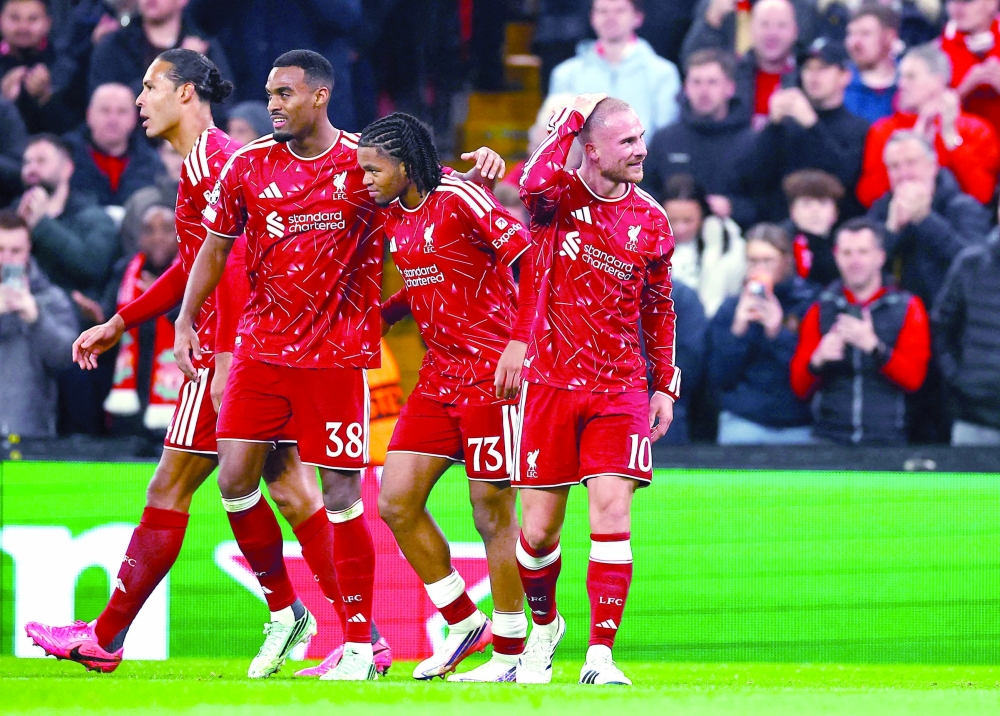 Liverpool's Alexis Mac Allister celebrates scoring their third goal with teammates against Villarreal at Anfield, Liverpool. — Reuters