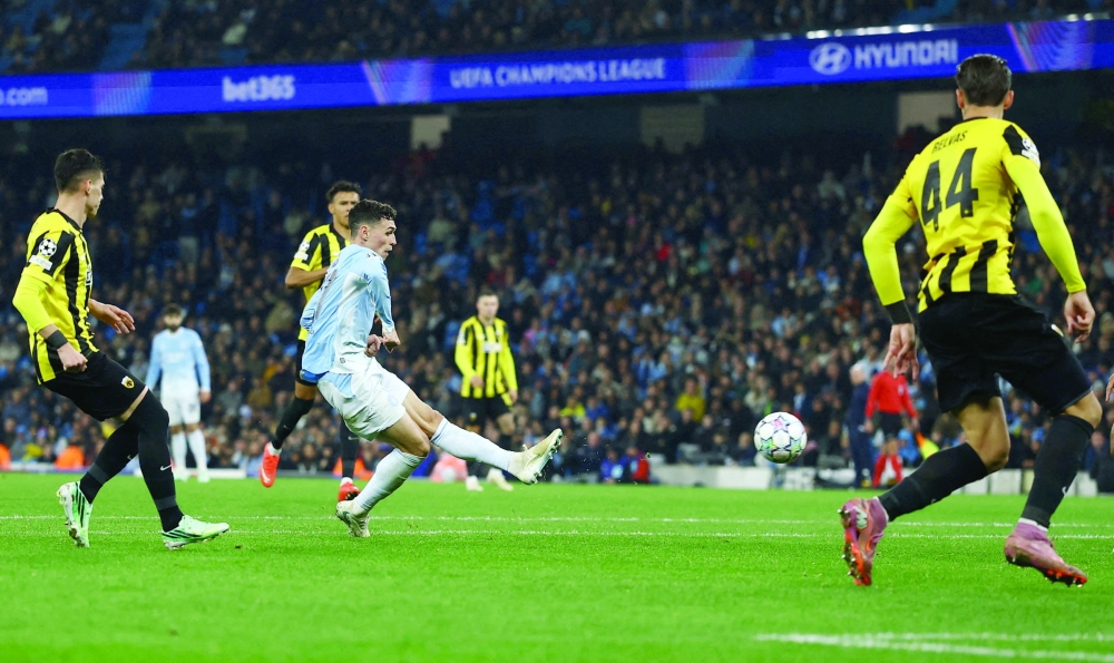 Manchester City's Phil Foden scores their fourth goal against AEK Athens in Manchester. — Reuters