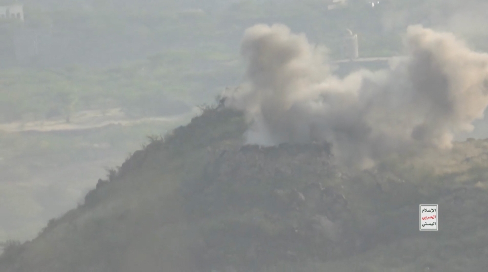 Smoke rises amid what Houthi Military Media says are clashes between Houthi fighters and Saudi-backed Yemeni government forces in a location given as Taiz, Yemen, in this screengrab from a video released October 20, 2026