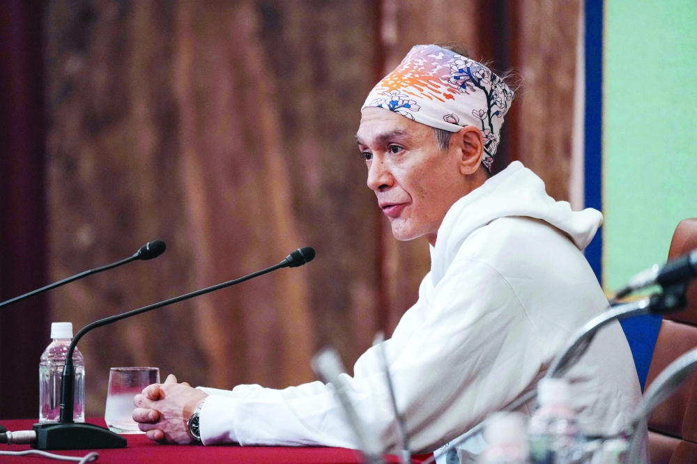 Kim Aris, son of Aung San Suu Kyi, at a press conference in Tokyo in this file photo. He said on Thursday he was allowed to speak to his detained mother for the first time in more than five years. — AFP