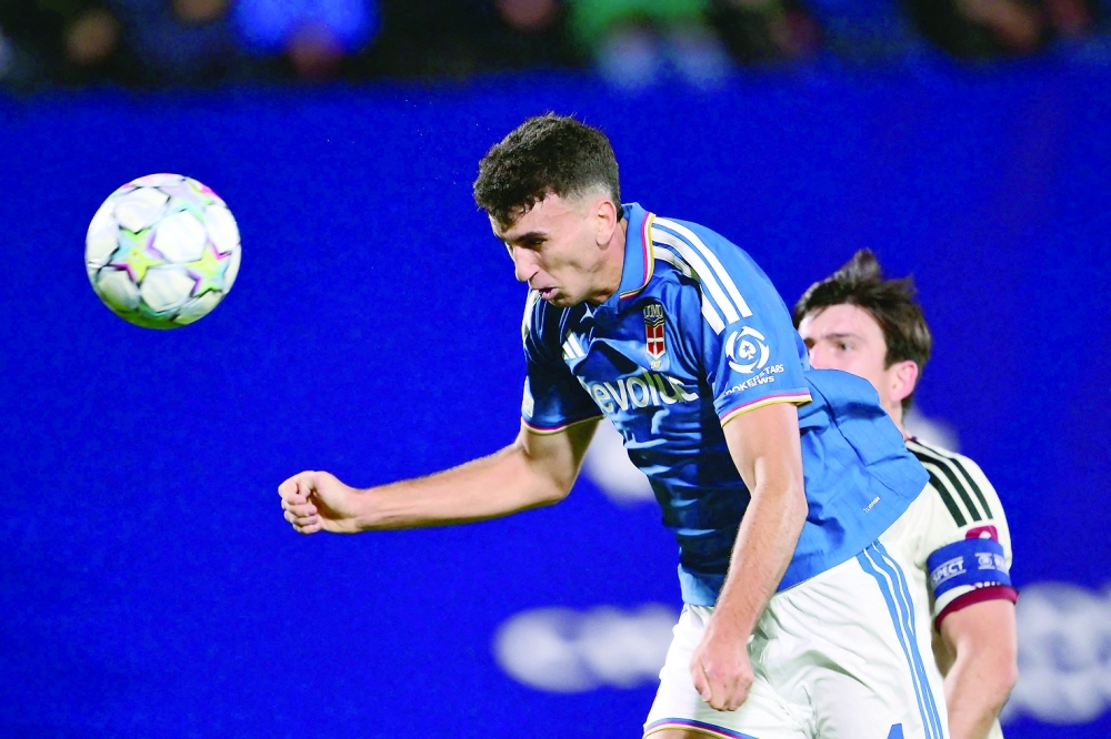 Como's Spanish defender #04 Jacobo Ramon scores his team's fourth goal during the UEFA Champions League, league phase matchday 3, football match between Como 1907 and Manchester United at the Stadio Giuseppe Sinigaglia in Como, northen Italy on October 21, 2026. (Photo by Marco BERTORELLO / AFP)
