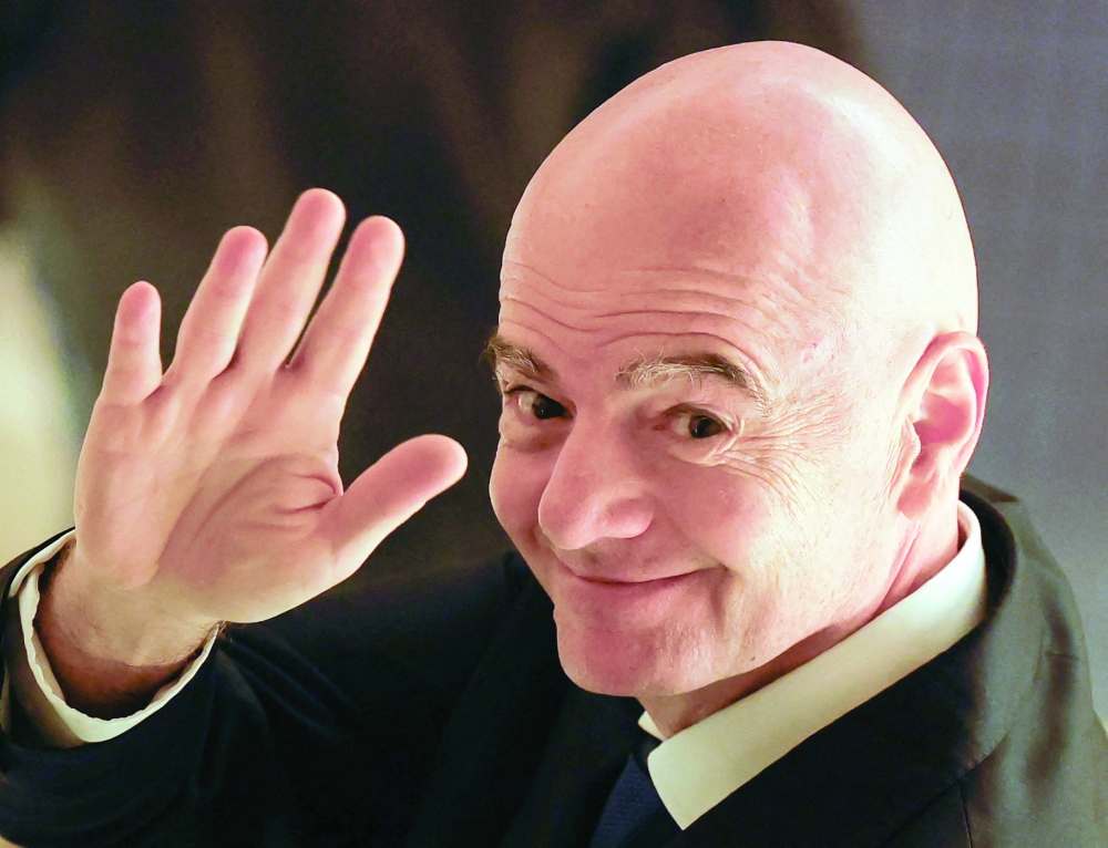 Fifa president Gianni Infantino waves to reporters as he leaves from a venue for the Asian Football Confederation (AFC)'s extraordinary congress in Tokyo, Japan, on Friday. 