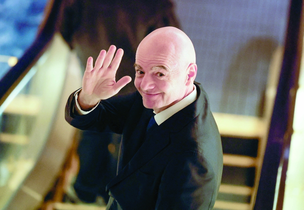 Fifa president Gianni Infantino waves to reporters as he leaves from a venue for the Asian Football Confederation (AFC)'s extraordinary congress in Tokyo, Japan, on Friday. 