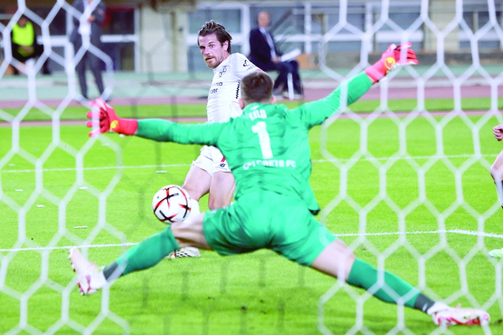 Leverkusen's German midfielder #07 Jonas Hofmann (L) scores during the UEFA Europa League, league phase matchday 3, football match between OFI Crete FC and Bayer Leverkusen at the Pankritio Stadium in Heraklion on October 22, 2026.  (Photo by Costas METAXAKIS / AFP)
