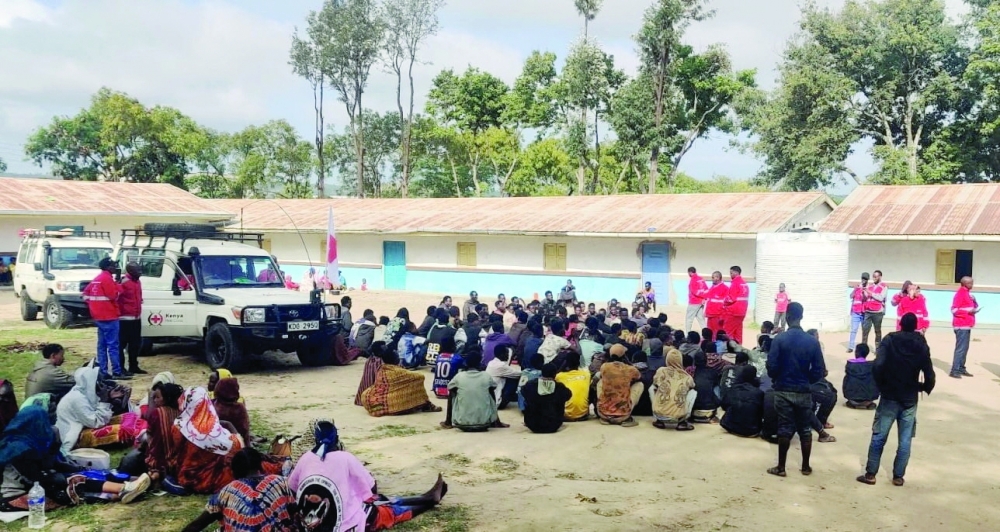 Kenya Red Cross officials gather with Ethiopians who fled after fighting erupted in the Ethiopian border town of Moyale. — Reuters