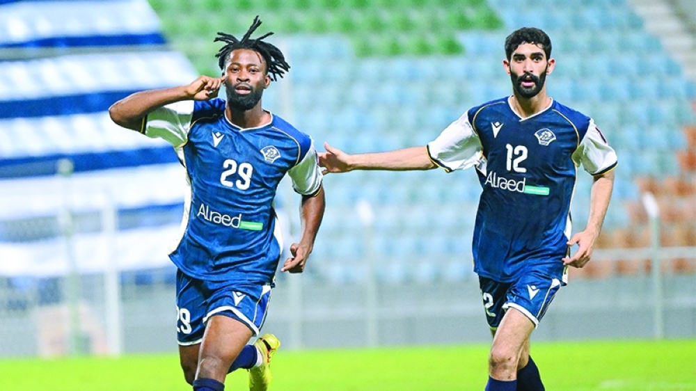 Al Shabab players celebrate after scoring a goal against Samayil.